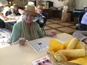Older lady playing bingo and having fun