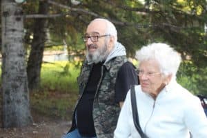 Elderly couple walking in woods