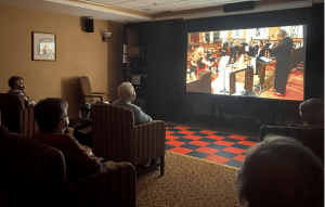 Tips for Helping a Senior Cope With Holiday Loneliness - All Seniors Care movie theatre