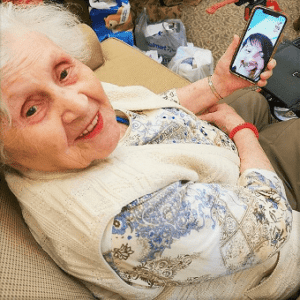 Senior Safety Part 2: Keeping You Safe at All Seniors Care - All Seniors Care lady with smartphone